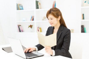 Beautiful young businesswoman working in office